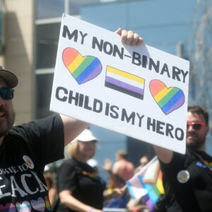 a man holding a sign