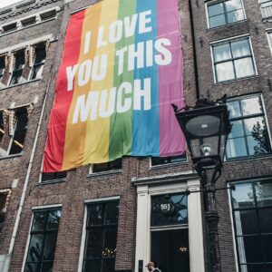 I love you this mush poster hanged on brown painted building