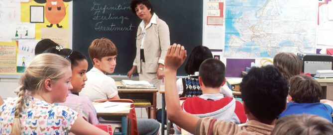 woman standing in front of children