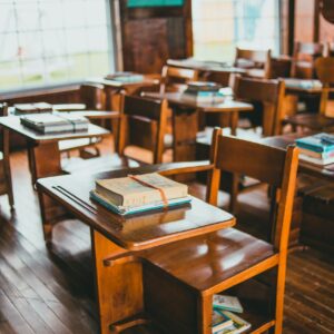 brown wooden table with books on top