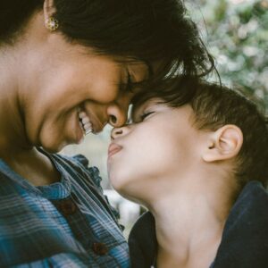 selective focus photography of woman and boy