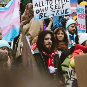 a group of people holding signs in the street